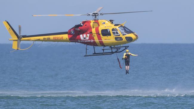 Rescuers helped three people after the boat capsized. Picture SIMON CROSS