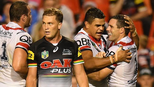 The Roosters celebrate Michael Gordon's try during their round 3 NRL match between the Penrith Panthers and the Sydney Roosters at Pepper Stadium in Sydney, Saturday, March 18, 2017. (AAP Image/Dean Lewins) NO ARCHIVING, EDITORIAL USE ONLY