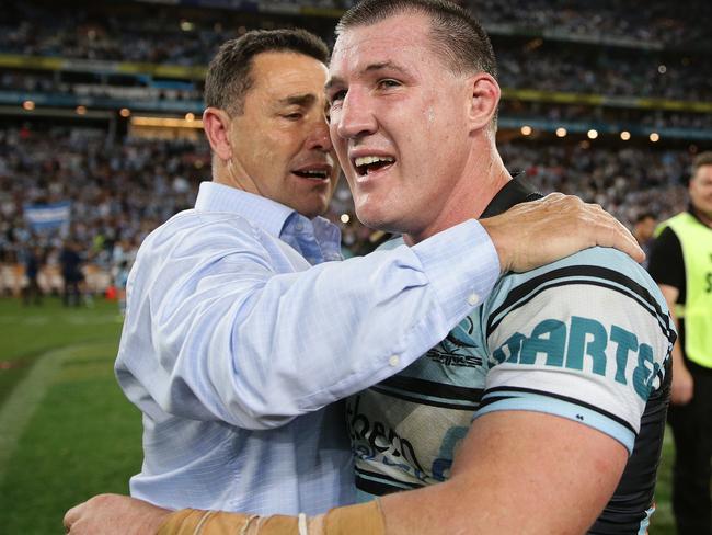 Shark's Paul Gallen and Shark's coach Shane Flanagan celebrate winning the grand final between the Cronulla Sharks and Melbourne Storm at ANZ Stadium, Sydney. Picture: Brett Costello
