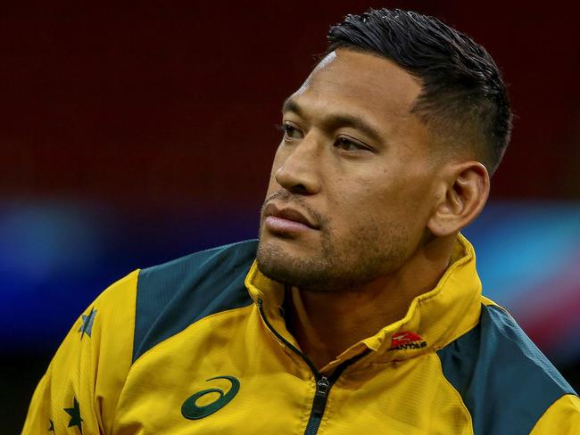 (FILES) In this file photo taken on November 9, 2018, Australia's wing Israel Folau attends the captain's run training session at the Principality stadium in Cardiff, south Wales, on the eve of their autumn international rugby union match against Wales. - Sacked Wallabies fullback Israel Folau launched legal action on June 6, 2019 against Rugby Australia's decision to dismiss him over homophobic social media posts, saying he was seeking "substantial remedies" from the governing body. Folau's contract was terminated in May after a Rugby Australia tribunal found him guilty of a "high-level" code of conduct breach for posting on social media that "hell awaits" gay people and others he considers sinners. (Photo by GEOFF CADDICK / AFP) / RESTRICTED TO EDITORIAL USE -use in books subject to Welsh Rugby Union (WRU) approval