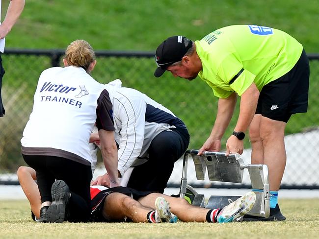 James Charbel of Watsonia receives medical attention after sustaining an injury which stopped play during the round four NFNL Division 2 MC Labour Seniors match between Watsonia and Panton Hill at Binnak Park, on April 27, 2024, in Melbourne, Australia. (Photo by Josh Chadwick)