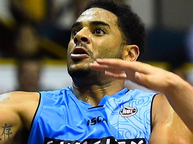 TOWNSVILLE, AUSTRALIA - DECEMBER 05: Corey Webster of the Breakers attempts a lay up past Mirko Djeric of the Crocodiles during the round nine NBL match between the Townsville Crocodiles and the New Zealand Breakers on December 5, 2015 in Townsville, Australia. (Photo by Ian Hitchcock/Getty Images)