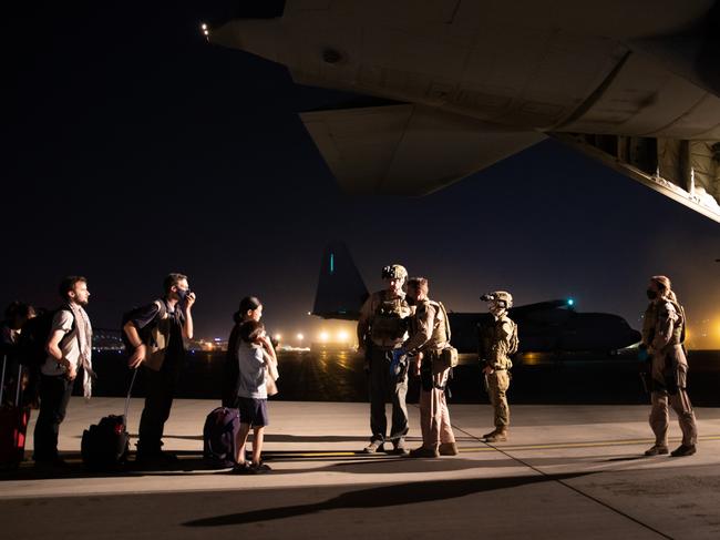 The first to be evacuated board the Australian aircraft.