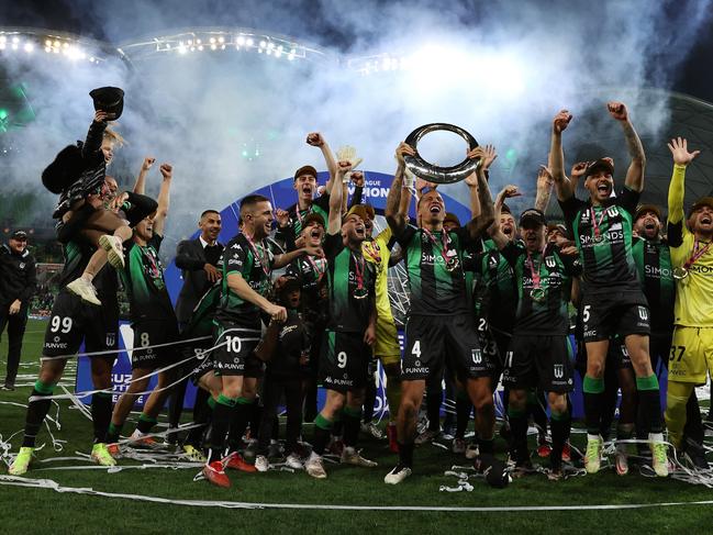 MELBOURNE, AUSTRALIA - MAY 28: Leo Lacroix of Western United holds the trophy aloft during the A-League Mens Grand Final match between Western United and Melbourne City at AAMI Park on May 28, 2022, in Melbourne, Australia. (Photo by Robert Cianflone/Getty Images)