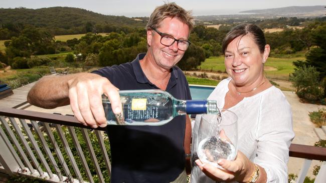 Olaf Lyche and wife Dayle Purcell with their Aqui-Live bottled water. Picture: Norm Oorloff