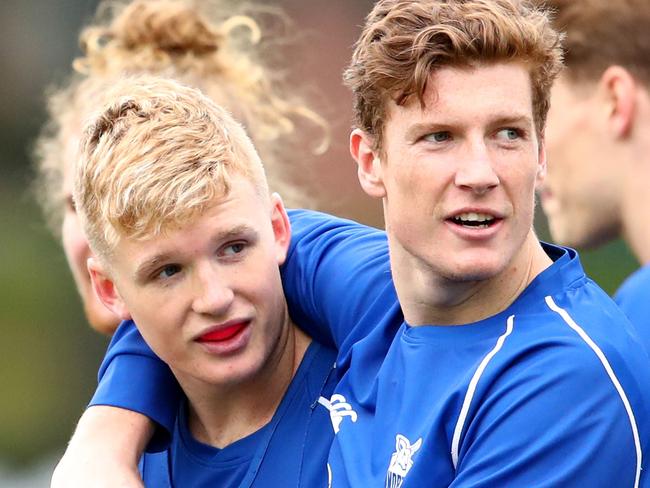 Red Og Murphy and Lachlan Hosie look on during a North Melbourne Kangaroos training session at Arden Street Oval, North Melbourne, Wednesday, August 7, 2019. (AAP Image/Scott Barbour) NO ARCHIVING