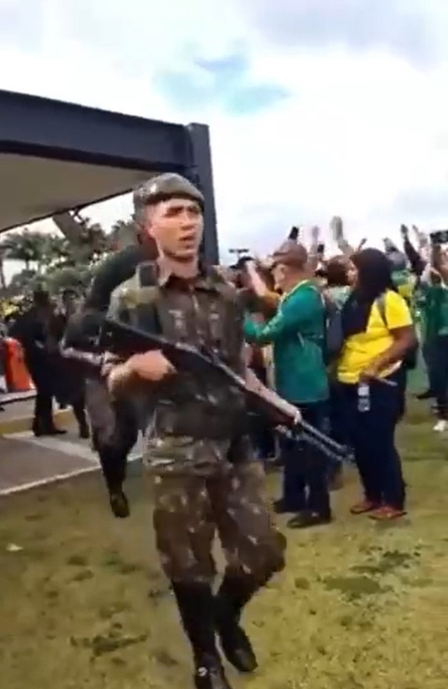 Protesters applauded as the Brazilian military entered the grounds of the presidential palace. Picture: Twitter