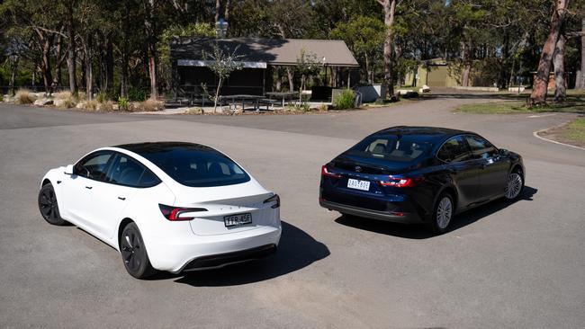 Tesla Model 3 and Toyota Camry Hybrid. Photo: Camber Collective