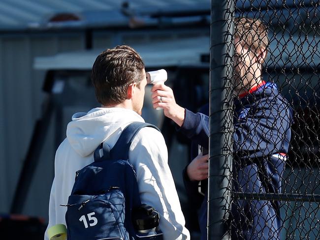 Western Bulldogs player Taylor Duryea gets a temperature test at Whitten Oval