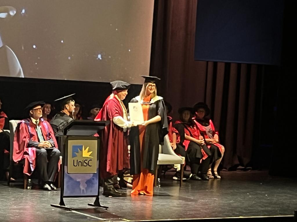 Graduates from the University of the Sunshine Coast's Fraser Coast campus celebrating at the Brolga Theatre.