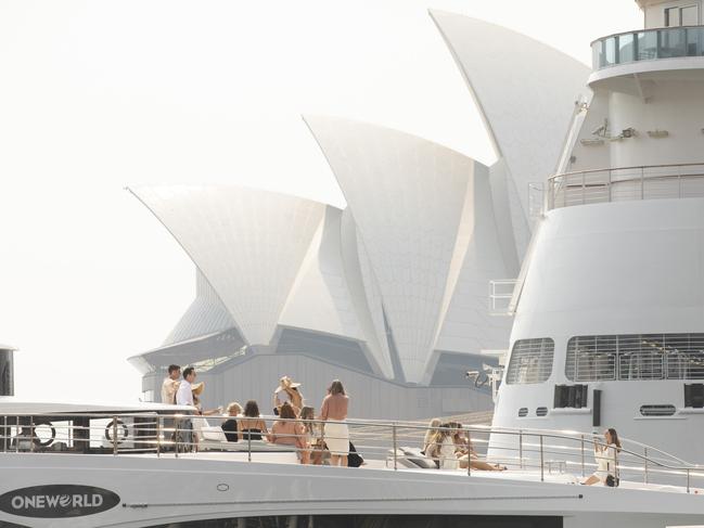 A yacht sails past the Sydney Opera House.