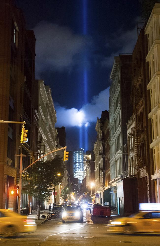 The Tribute in Light rises behind buildings adjacent to the World Trade Center complex at the National September 11 Memorial on Monday, Sept. 8, 2014, in New York. The tribute, an art installation of 88 searchlights aiming skyward in two columns, is a remembrance of the Sept. 11, 2001, attacks. Picture: Charles Sykes