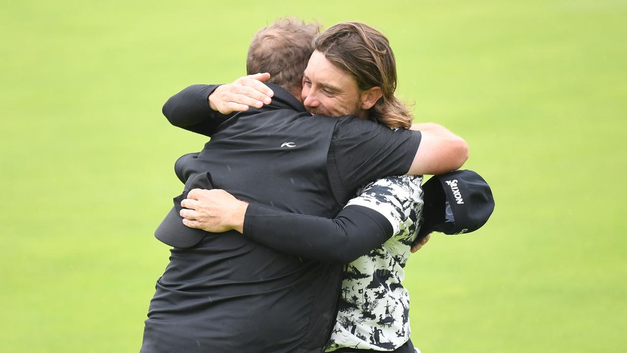 Ireland's Shane Lowry embraces England's Tommy Fleetwood after winning the British Open. (Photo by Andy BUCHANAN / AFP)