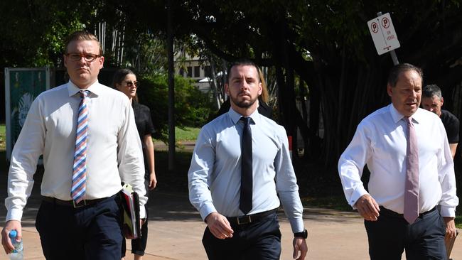 Zachary Rolfe,c entre, enters the Northern Territory Supreme Court on Thursday ahead of closing arguments in his trial.