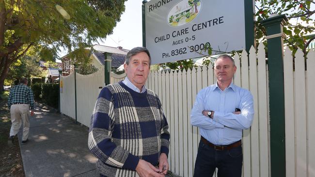 Neighbours Chris Puplick (left) and Dan McNamara outside the childcare centre. Picture: Adam Ward