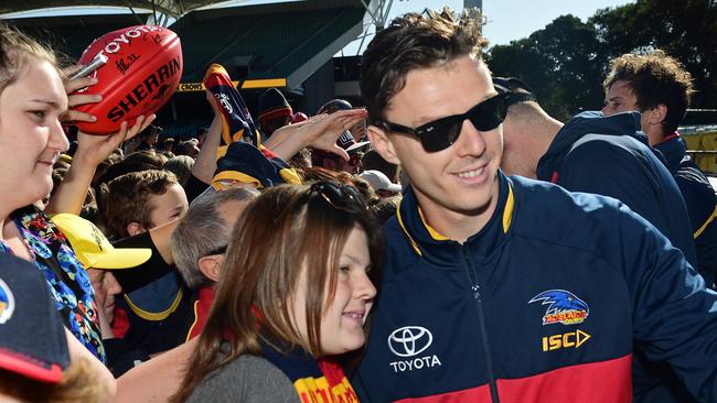 Crows fans greet Jake Lever and his teammates after the grand final loss to Richmond. Picture: Tom Huntley.