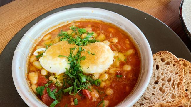 Huevos a la flamenco – tomato braised pork hock, white beans, poached eggs and manchego cheese at Comida, Hahndorf