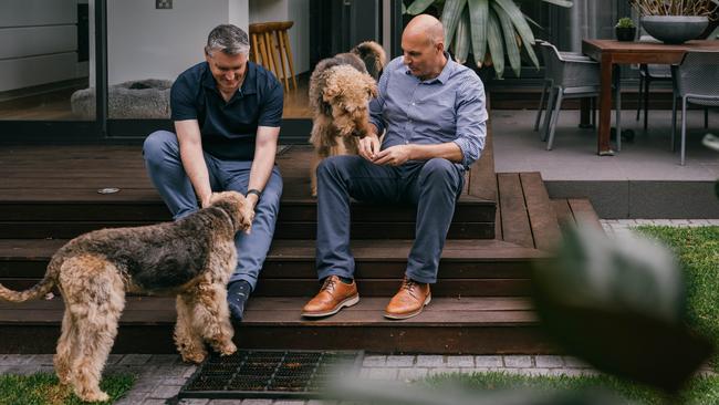 Charles and Jeffrey at home with their dogs Murray and Rosie.