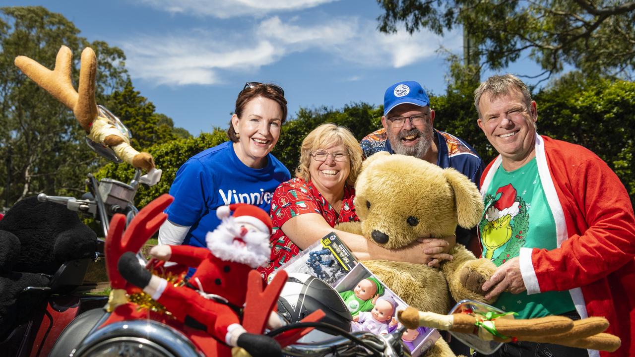 St Vincent de Paul Society volunteer Christine Harpham (left) and Toowoomba president Peter Cavanagh (centre) with riders Allison and John McCreanor of Brisbane Ulysses Club at Picnic Point for the Toowoomba Toy Run hosted by Downs Motorcycle Sporting Club, Sunday, December 18, 2022.
