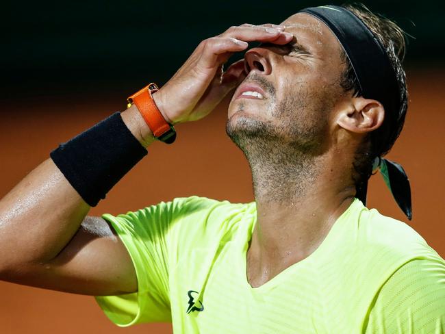 TOPSHOT - Spain's Rafael Nadal reacts after losing a point to Argentina's Diego Schwartzman during their quarter final match of the Men's Italian Open at Foro Italico on September 19, 2020 in Rome, Italy. (Photo by Clive Brunskill / POOL / AFP)