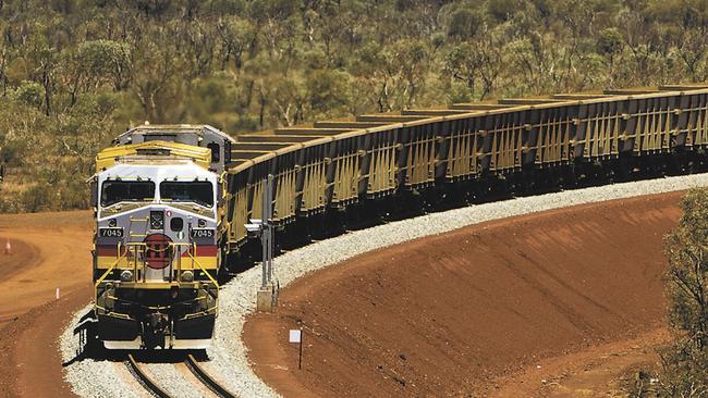 An undated handout photo as supplied by Rio Tinto on Wednesday, June 18, 2008 of an iron ore train in the Pilbara, Western Australia. Mining giants Rio Tinto and BHP are jointly locked in a legal dispute over third party access to its owned and operated railways which Forstescue Metals and a number of other junior iron ore miners are seeking to gain access to. (AAP Image/Rio Tinto, Christian Sprogoe) NO ARCHIVING, EDITORIAL USE ONLY