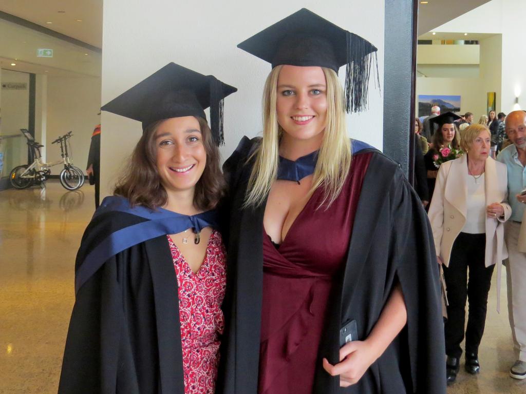 Bachelor of Arts graduates Madeleine Rojahn, left, and April McLennan. Picture: SUPPLIED