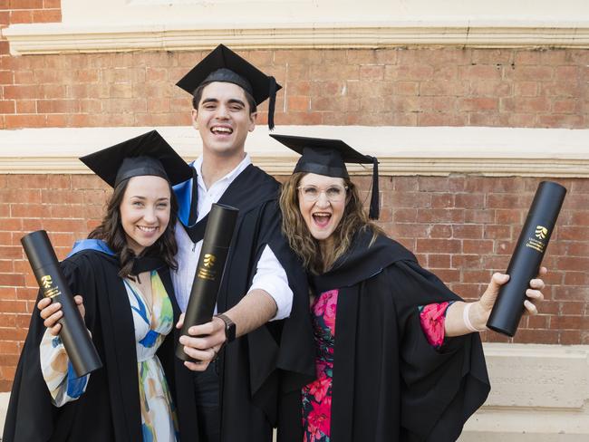 Bachelor of Nursing graduates Louise McDonald (right) with her daughter Sophie Edser and son-in-law Ryley Edser at the UniSQ graduation ceremony at Empire Theatres, Tuesday, October 31, 2023. Picture: Kevin Farmer