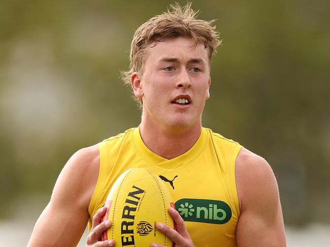 MELBOURNE, AUSTRALIA - MARCH 07: Kane McAuliffe of the Tigers controls the ball during a Richmond Tigers AFL Training Session & Media Opportunity at Punt Road Oval on March 07, 2024 in Melbourne, Australia. (Photo by Robert Cianflone/Getty Images)