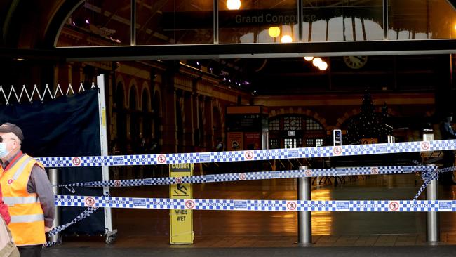 Police pictured in front of a crime scene at Central station where a man was stabbed on Saturday. Picture: Damian Shaw