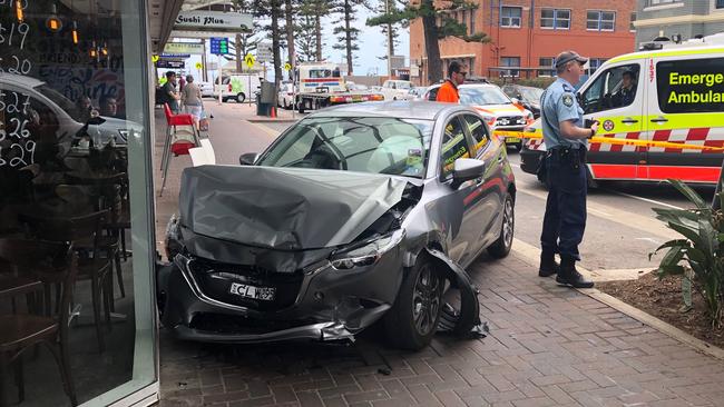 A car ended up just centimetres from a popular Manly eatery, Fusion Point, after its driver suffered a medical episode and lost control of the vehicle in Wentworth St, near Rialto Ln. Picture: Jim O'Rourke