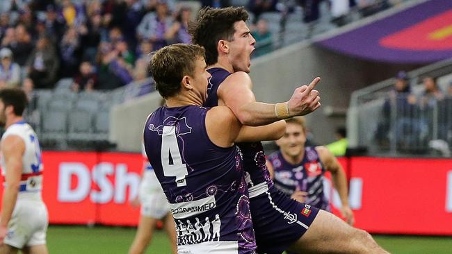 PERTH, AUSTRALIA - JUNE 06: Andrew Brayshaw of the Dockers celebrates with Sean Darcy after scoring a goal during the 2021 AFL Round 12 match between the Fremantle Dockers and the Western Bulldogs at Optus Stadium on June 6, 2021 in Perth, Australia. (Photo by Will Russell/AFL Photos via Getty Images)