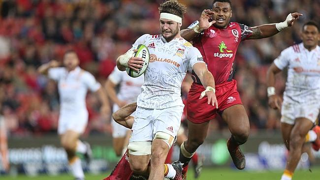 Lachlan Boshier of the Chiefs makes a break to score agains he hapless Reds.
