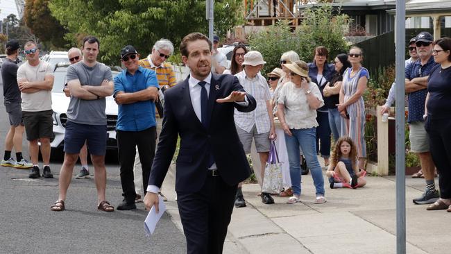 Tom Butters calls for bids at 55 Bond St, Newtown. The home sold for $1.826m