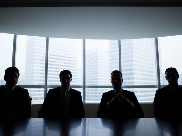 Silhouette row of businessmen sitting in meeting roomMen boardroom business company directors