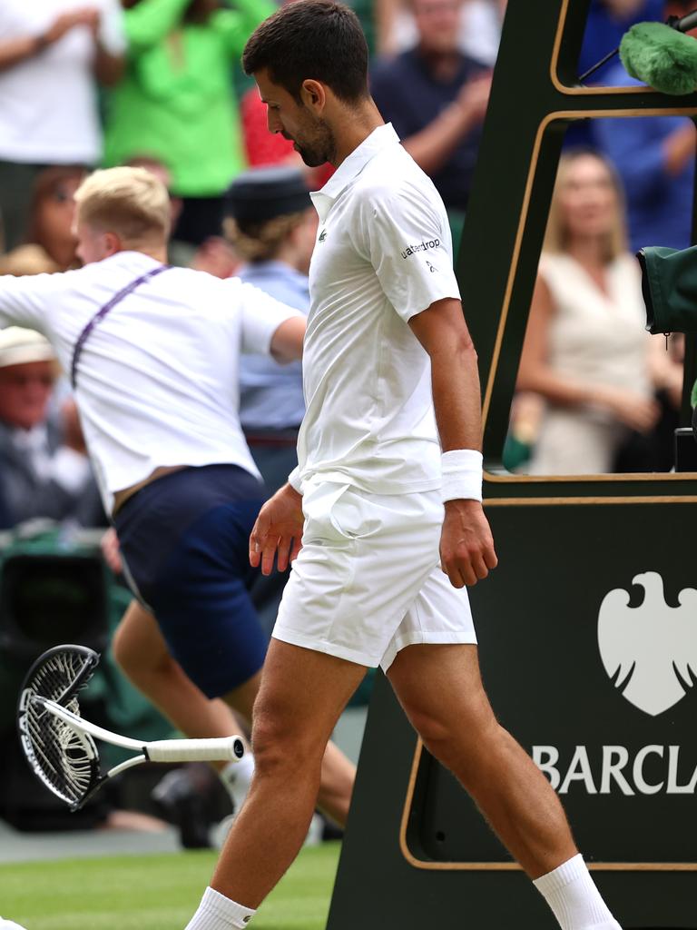 Novak Djokovic smashes his racquet during the Wimbledon final. (Photo by Clive Brunskill/Getty Images)