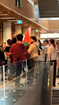 'F**k you': Fiery clash as protestors storm UQ building