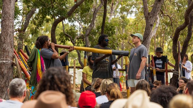 People take part in the Yidaki (didgeridoo) Healing during the Garma Festival. Picture: Tamati Smith/ Getty Images