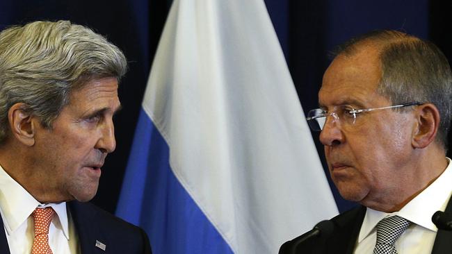 US Secretary of State John Kerry, left, talks with Russian Foreign Minister Sergei Lavrov during their joint news conference following their meeting to discuss the crisis in Syria, in Geneva, Switzerland. Picture: Kevin Lamarque.