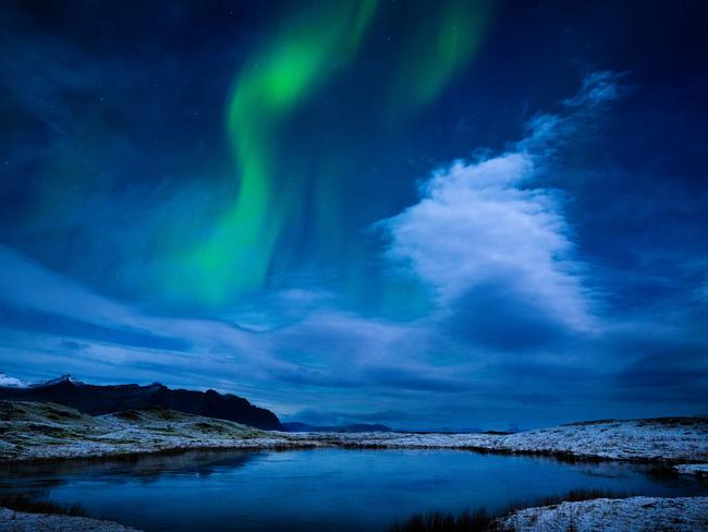 The Northern Lights cast a spectacular display above southeastern Iceland’s Heinabergsjökull Glacier, illuminating the December night sky with vibrant colours. Picture: Deanne Fitzmaurice