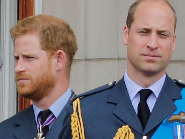 (FILES) In this file photo taken on July 10, 2018 (L-R) Britain's Meghan, Duchess of Sussex, Britain's Prince Harry, Duke of Sussex, and Britain's Prince William, Duke of Cambridge, stand on the balcony of Buckingham Palace to watch a military fly-past to mark the centenary of the Royal Air Force (RAF). - Britain's Prince Harry and his wife Meghan will step back as senior members of the royal family and spend more time in North America, the couple said in a shock announcement on January 8, 2020. The surprise news follows a turbulent year for the monarchy, with signs that the couple have increasingly struggled with the pressures of royal life and family rifts. "We intend to step back as 'senior' members of the royal family and work to become financially independent, while continuing to fully support Her Majesty The Queen," they said in a statement released by Buckingham Palace. (Photo by Tolga AKMEN / AFP)