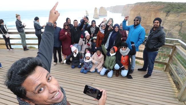 Shahria Mahbub, from Sydney, with his extended family from Bangladesh, visit the Twelve Apostles. Picture: Alex Coppel