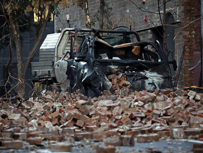 The ute trapped in the fire wreckage. Picture: Adam Yip