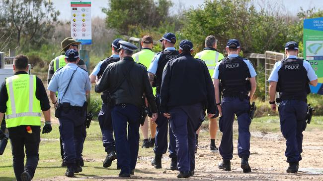 DAILY TELEGRAPH. Police move in to assist Northern Beaches Council workers as the evict and demolishing a camp where people have been living in the dunes at Dee Why Beach. 31/08/2023. Pic by Max Mason-Hubers