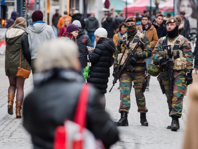 Heightened alert ... Soldiers from the Belgian army patrol in the picturesque Grand Place in Brussels. Source: AP