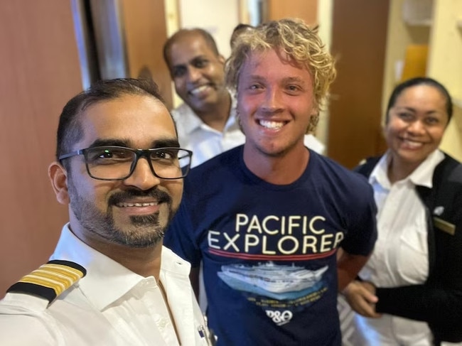 Hours after the rescue, Robinson was pictured in good spirits with crew of the P&amp;O Ship. Picture: Carnival Australia