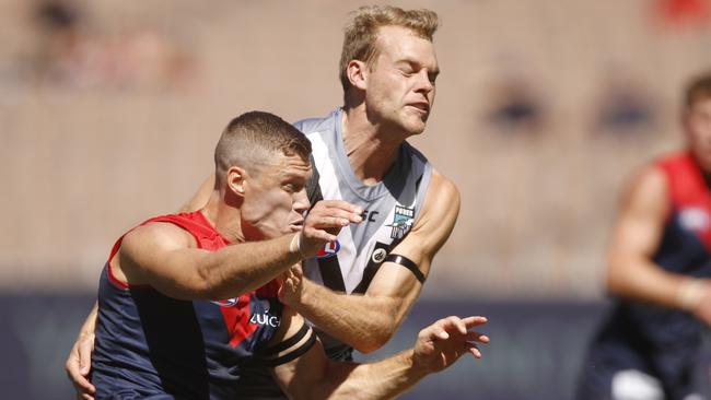 Jack Watts of the Power and Jake Melksham of the Demons contest the ball during the Round 1 AFL match between the Melbourne Demons and the Port Adelaide Power at the MCG in Melbourne, Saturday, March 23, 2019. (AAP Image/Daniel Pockett) NO ARCHIVING, EDITORIAL USE ONLY