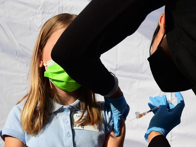 A child receives a dose of Pfizer’s Covid-19 vaccine in Los Angeles. Picture: Frederic J. Brown/AFP