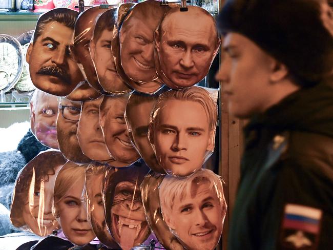 TOPSHOT - Masks of Russian President Vladimir Putin and former US President and Republican presidential candidate Donald Trump are seen on sale at a souvenir kiosk in central Saint Petersburg on November 6, 2024. The Kremlin said on November 6, 2024 it would judge Donald Trump, who claimed victory in the US presidential election, on his actions and that President Vladimir Putin had no plans to congratulate him. (Photo by Olga MALTSEVA / AFP)