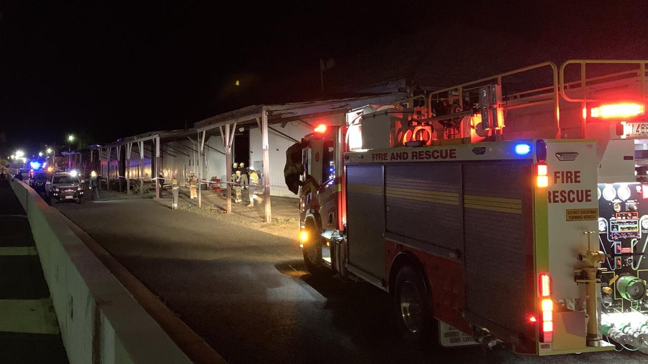 Firefighters and police assess the scene of a building collapse along River Street in Mackay CBD. A 15m by 15m part of the floor has fallen into the Pioneer River. Picture: Rae Wilson