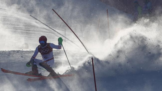 Austria’s Marcel Hirscher has trouble with a gate during the first run of the men's slalom. Picture: AP